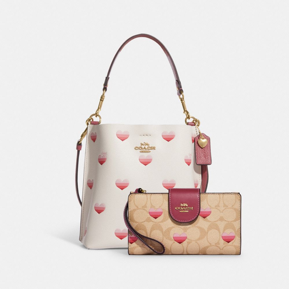 Coach Nolita 19 In Signature Canvas With Stripe Heart Print