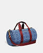 COACH®,DUFFLE IN SIGNATURE DENIM,Calf Leather,X-Large,Washed Denim,Angle View