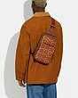 COACH®,GOTHAM PACK IN SIGNATURE LEATHER,Polished Pebble Leather,Medium,Saddle/Papaya,Detail View