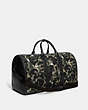 COACH®,GOTHAM DUFFLE IN CANVAS WITH CAMO PRINT,Refined Calf Leather,X-Large,Green/Blue,Angle View