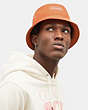 COACH®,BUCKET HAT WITH COACH,cotton,Faded Orange,Detail View