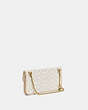 COACH®,FOLDOVER CUT OUT CLUTCH CROSSBODY IN SIGNATURE JACQUARD,Jacquard/Smooth Leather,Mini,Brass/Chalk Ivory,Angle View