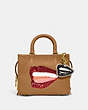 COACH®,COACH X TOM WESSELMANN LIPS BAG CHARM,Glovetanned Leather,Mini,Brass/Ivory,Angle View
