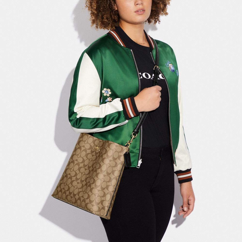 COACH®,Mollie Bucket Bag In Signature Canvas,Canvas,Leather,Crossbody,Logo,Gold Metal,Casual,Brown,Detail View