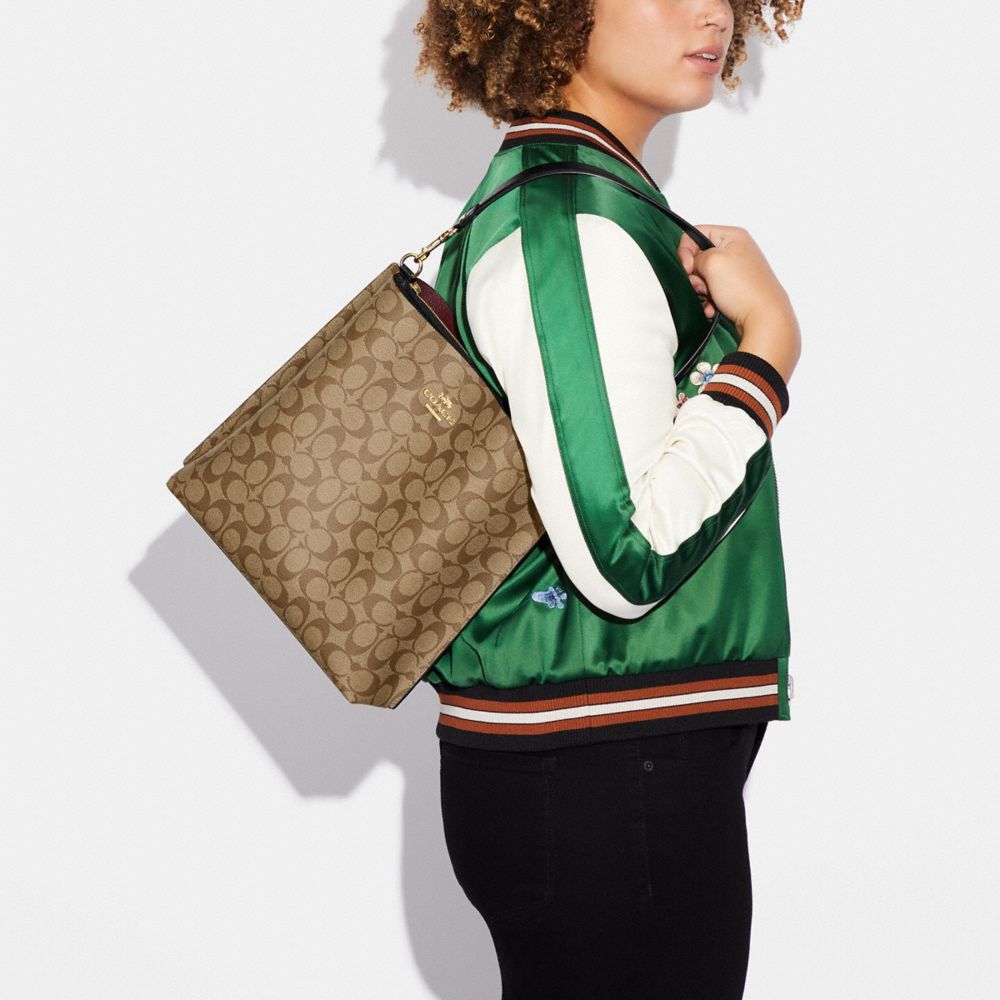 COACH®,Mollie Bucket Bag In Signature Canvas,Canvas,Leather,Crossbody,Logo,Gold Metal,Casual,Brown,Detail View