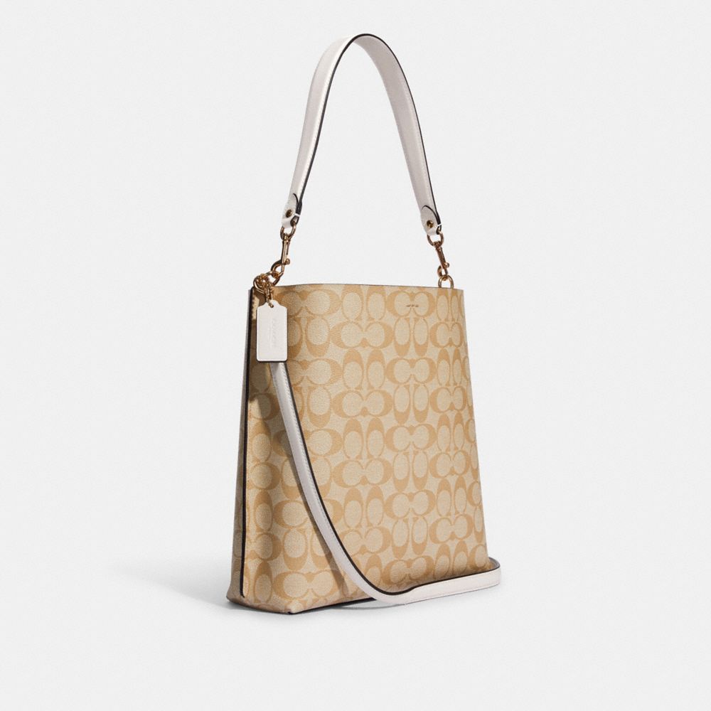 COACH®,MOLLIE BUCKET BAG IN SIGNATURE CANVAS,Signature Canvas,Large,Anniversary,Gold/Light Khaki Chalk,Angle View