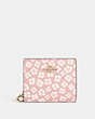 COACH®,SNAP WALLET WITH GRAPHIC DITSY FLORAL PRINT,Gold/Pink Multi,Front View