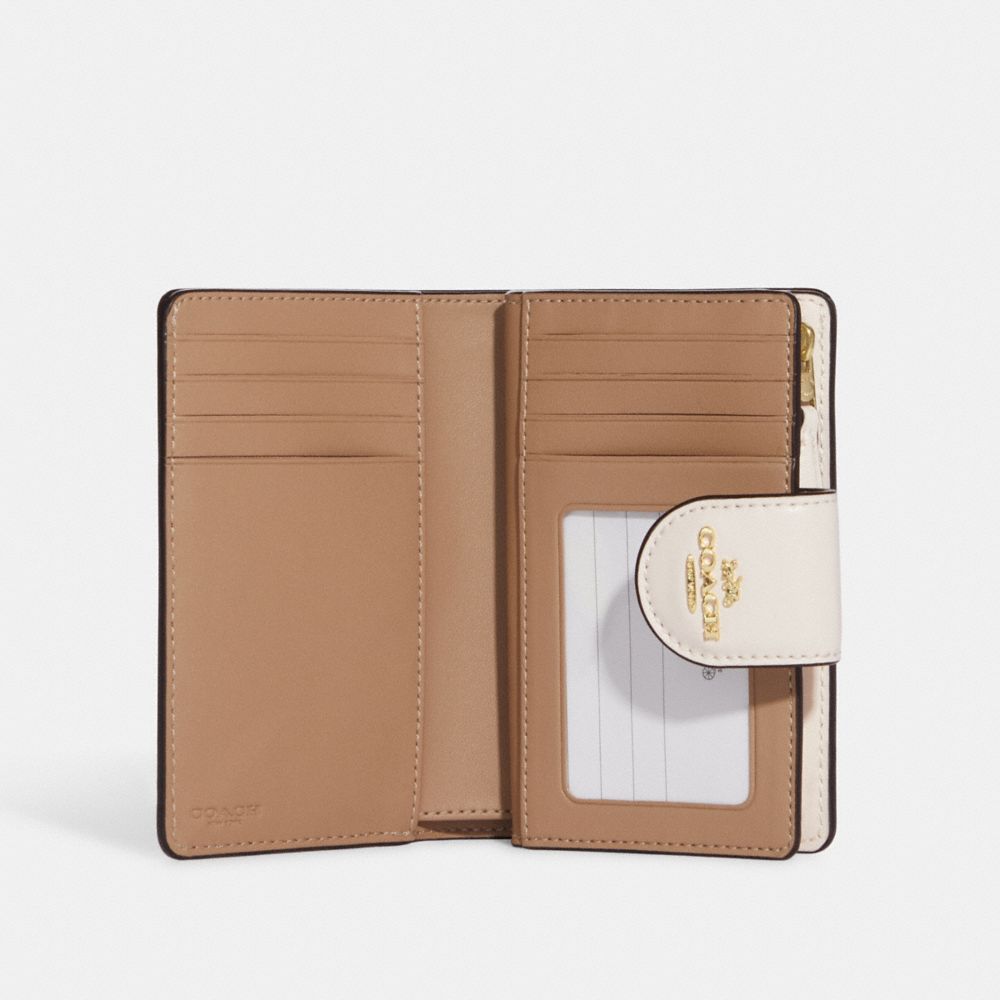 Portefeuille de taille moyenne à zip en coin à imprimé escargots