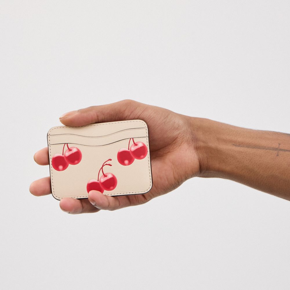 COACH®,Wavy Card Case In Regenerative Leather With Cherry Print,Polyester,Card Case,Faux Leather,Logo,Pattern,Embossed,Sus...,Cream,Detail View