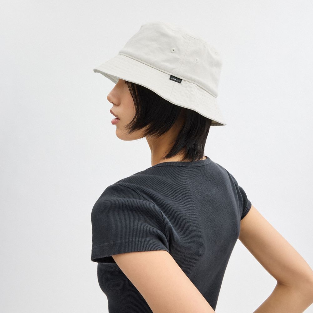 COACH®,Denim Bucket Hat,Cotton,Lining Cotton,Bucket,Embroidered,Tag Embellishment,Logo,Casual,White,Angle View