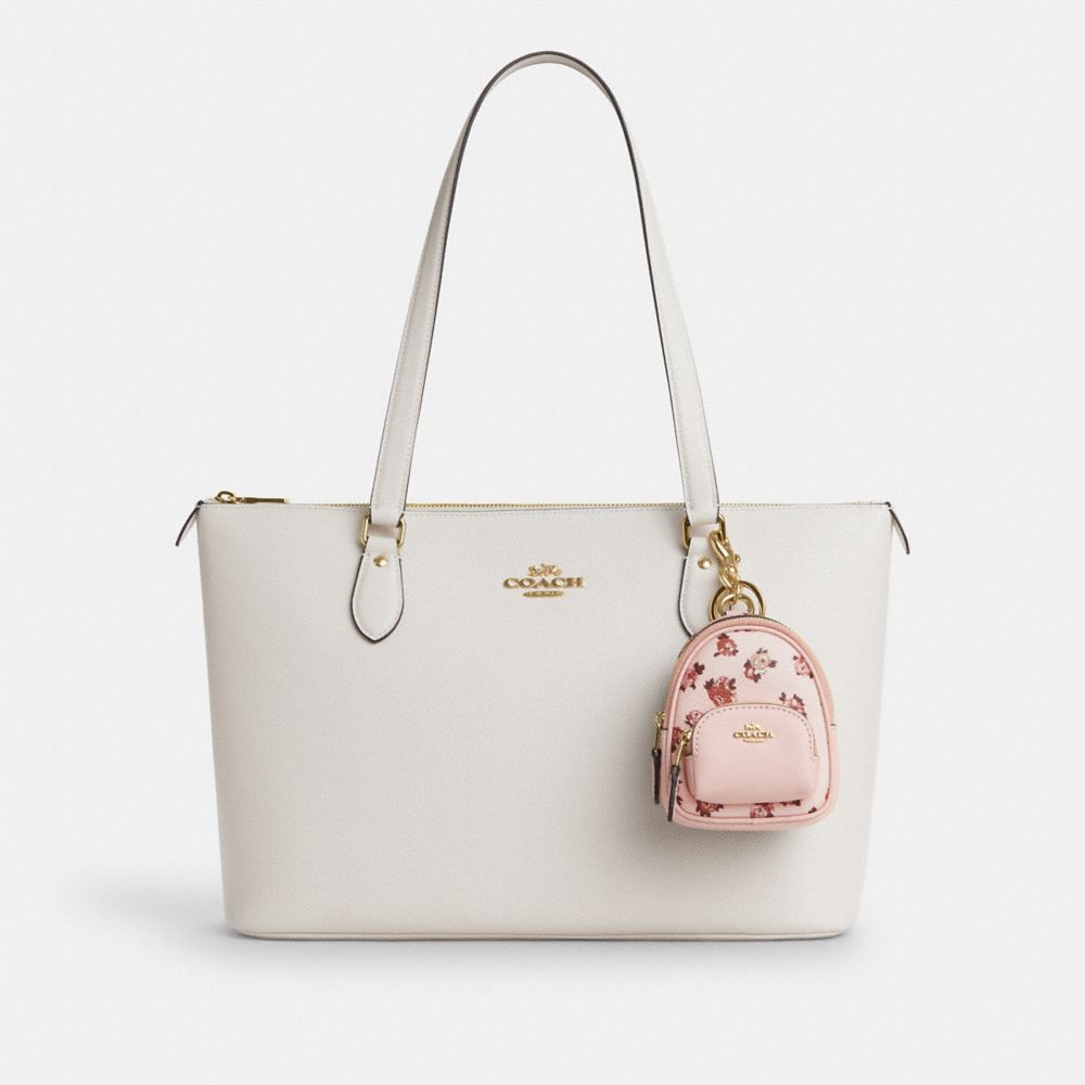 COACH®,Mini Court Backpack Bag Charm With Rosette Print,Canvas,Leather,Bag Charm,Logo,Metal,Key Ring,Day Party,Pink,Angle View