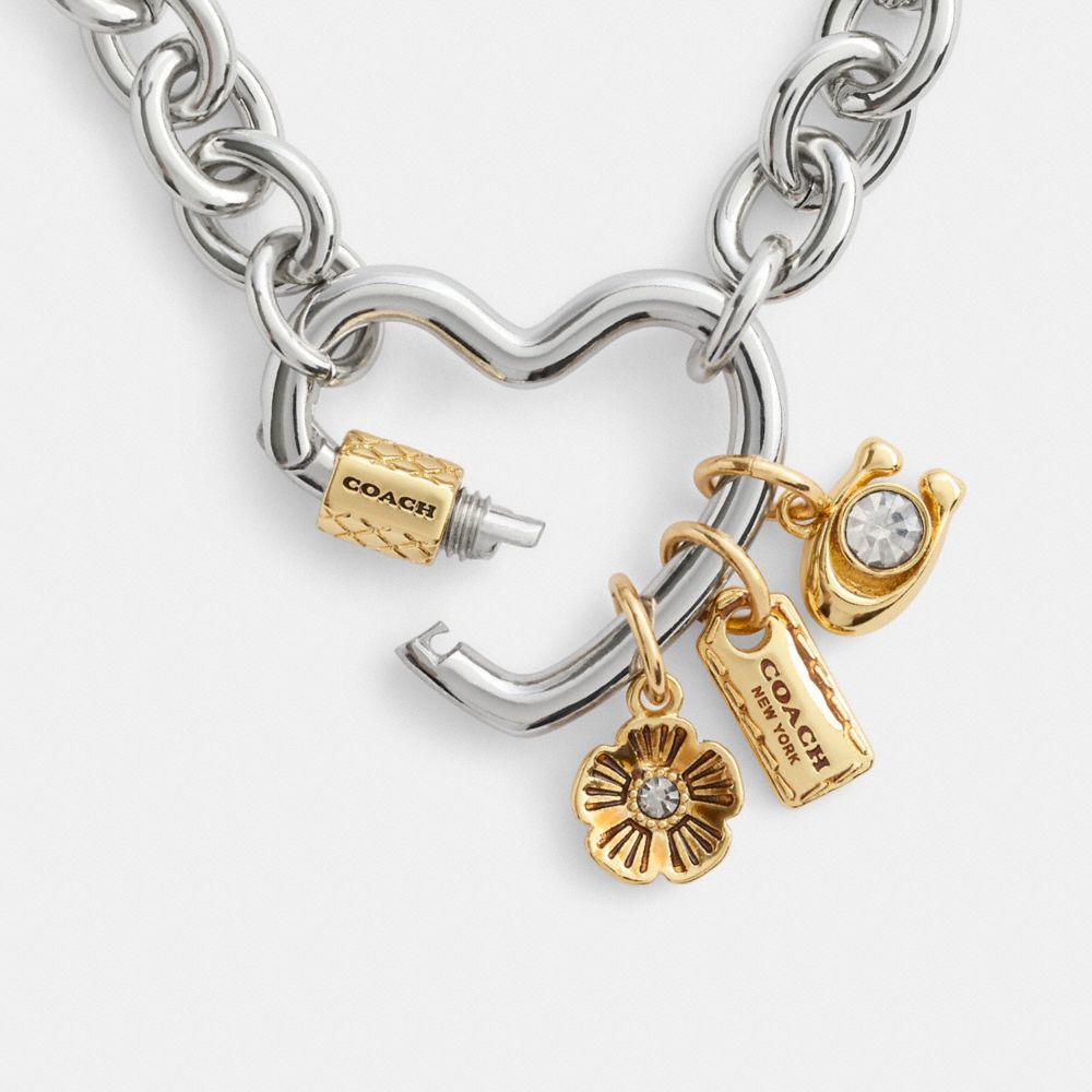 COACH®,Carabiner Heart Charm Necklace,Single Strand,Cubic Zirconia,Glass,Bar Embellishment,Floral Embellishment,Logo,Casual,Clear,Alternate View