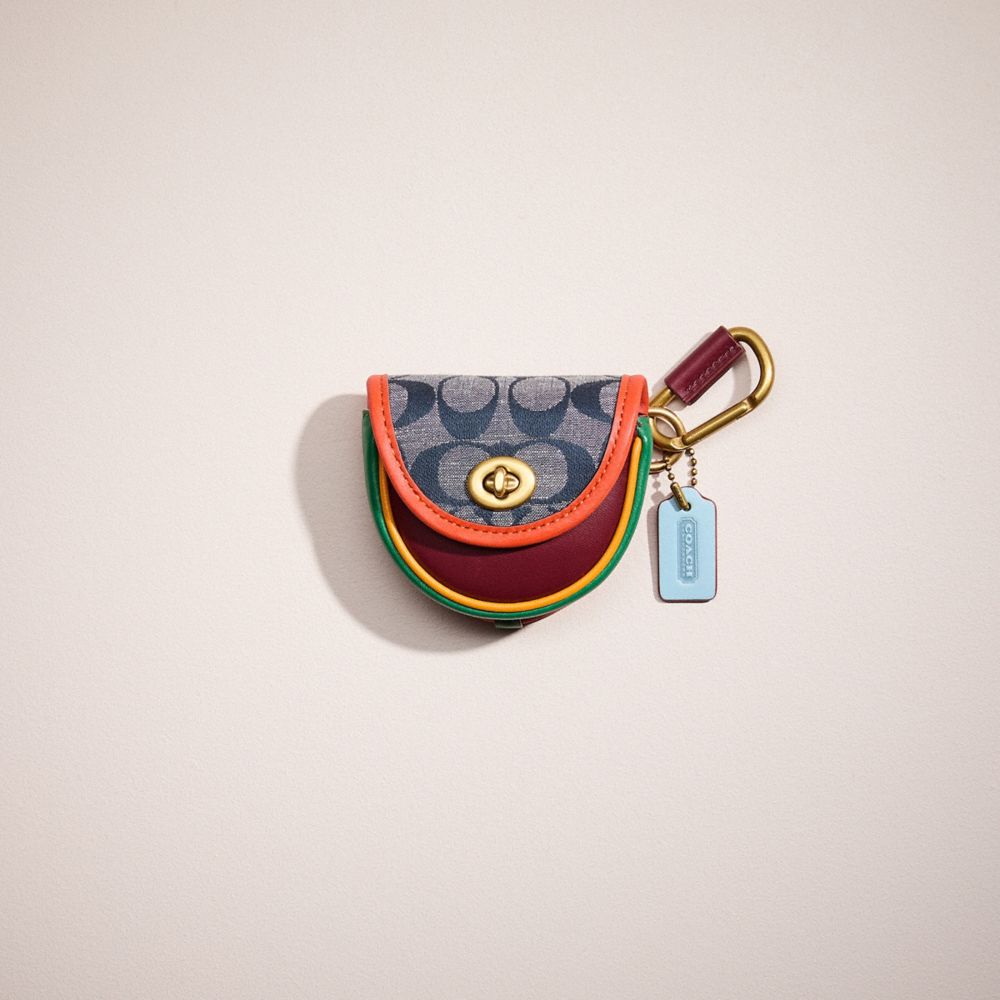 Saddle bag charm coach sale