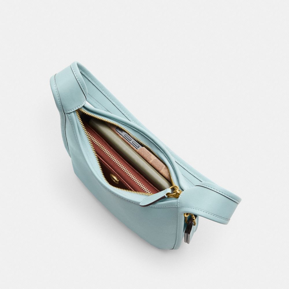 Coach Curve Zip Bag In Brass/light Blue