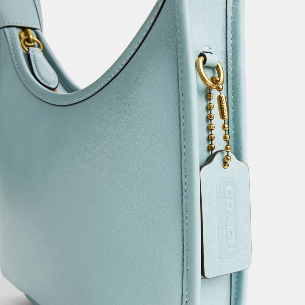 Coach Curve Zip Bag In Brass/light Blue