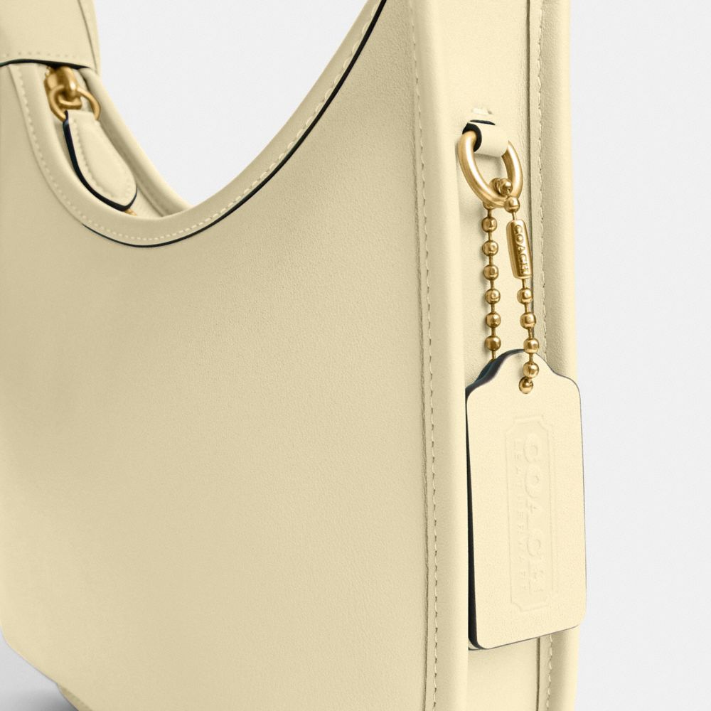 Coach Curve Zip Bag In Brass/moonlight