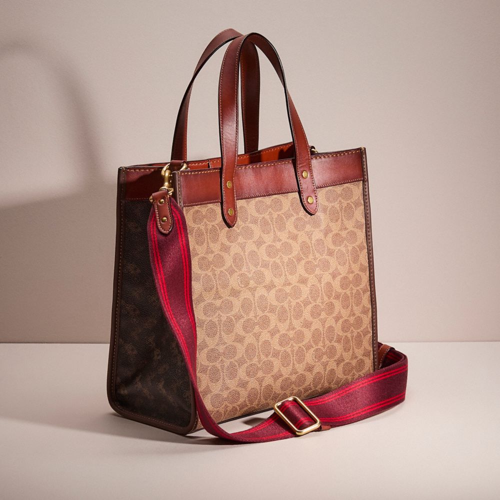 COACH®,Upcrafted Field Tote In Signature Canvas With Horse And Carriage Print,,Angle View