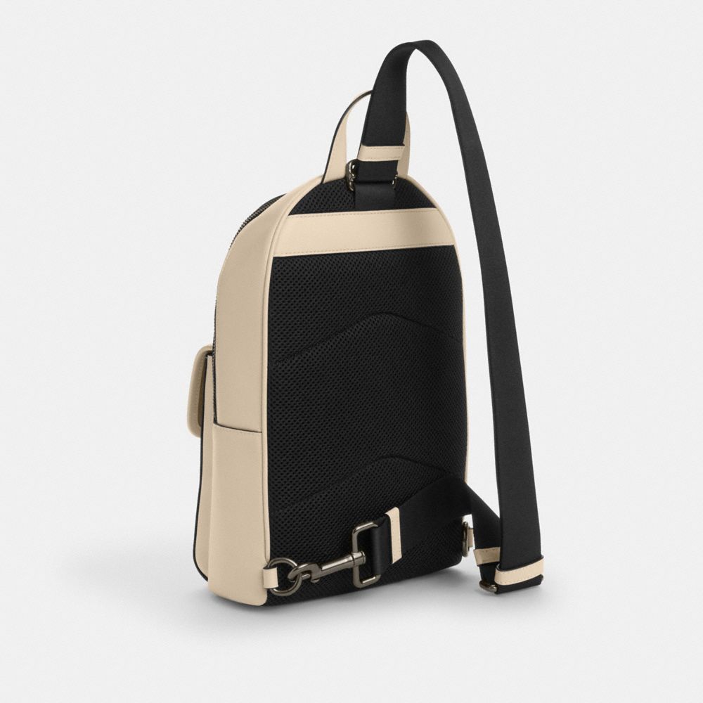 COACH®,Turnlock Sling Pack,Beige,Angle View
