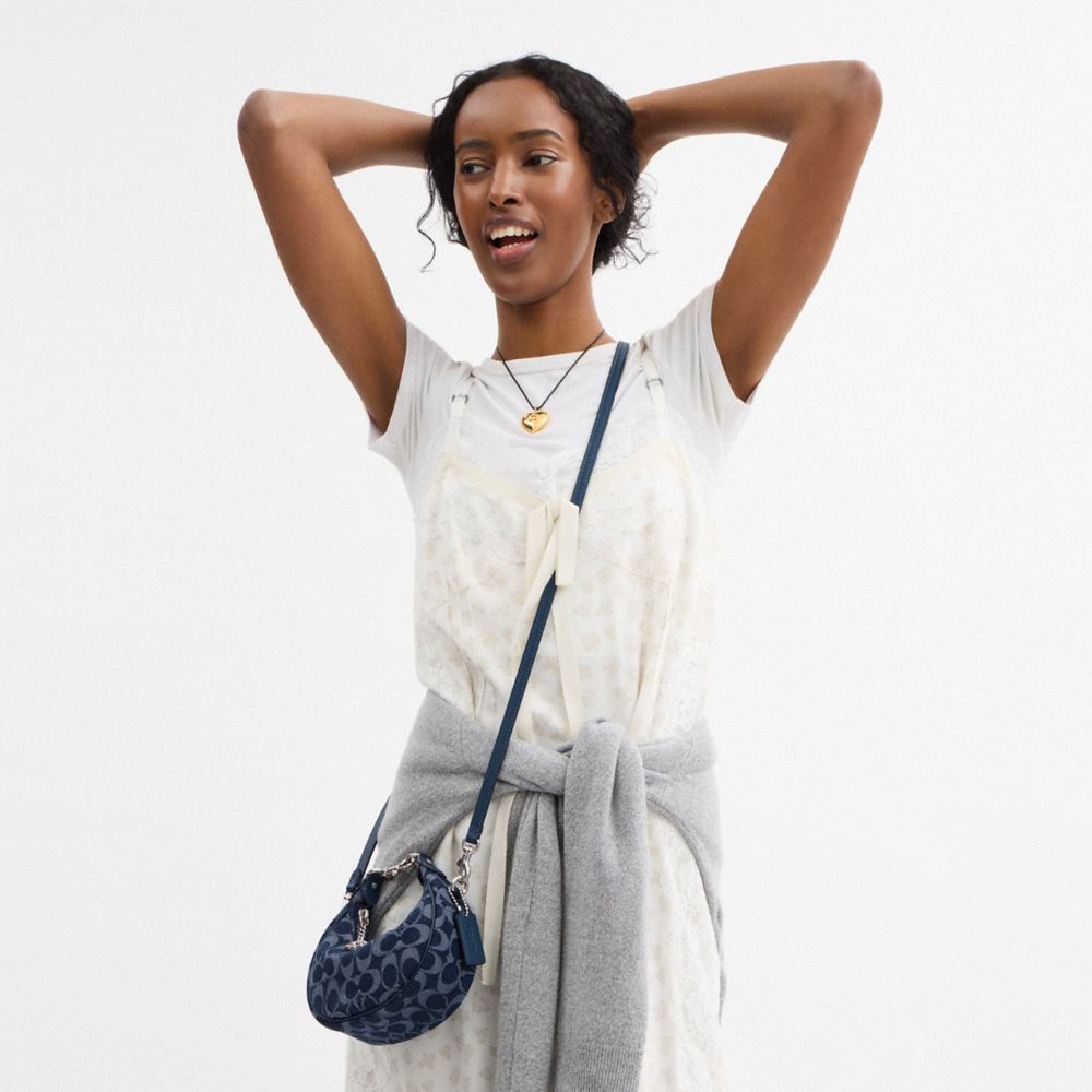 Shop Coach Jonie Bag In Signature Denim In Silver/deep Blue Multi