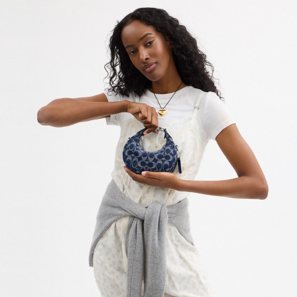 Shop Coach Jonie Bag In Signature Denim In Silver/deep Blue Multi