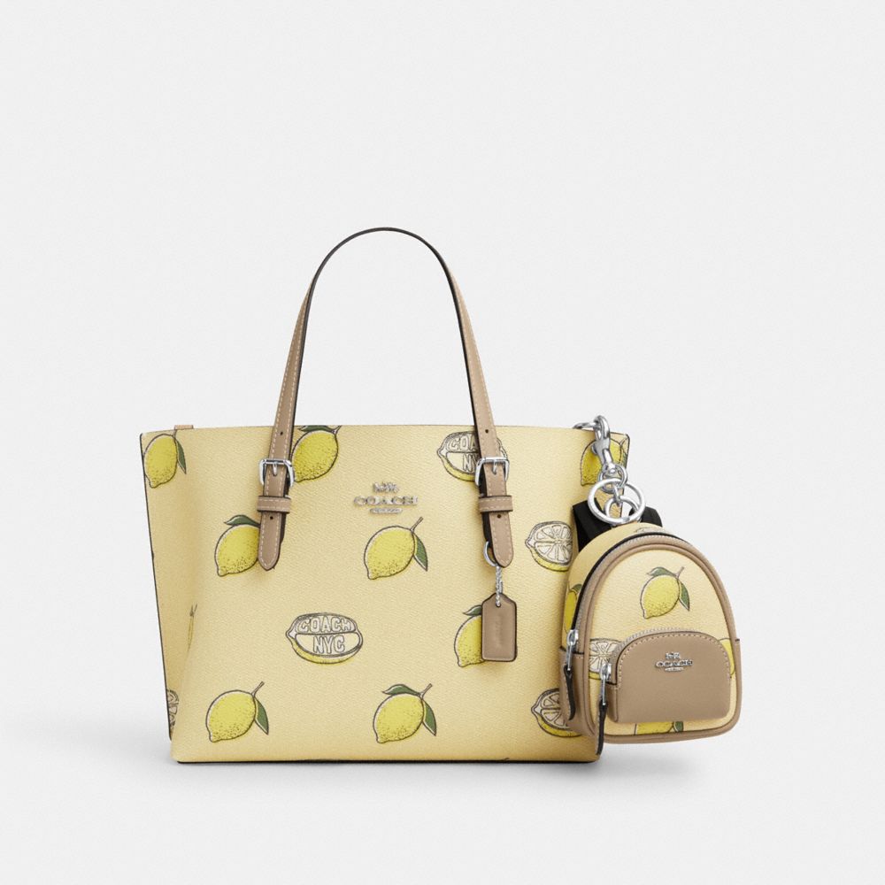COACH®,Mini Court Backpack Bag Charm With Lemon Print,Multi Color,Angle View