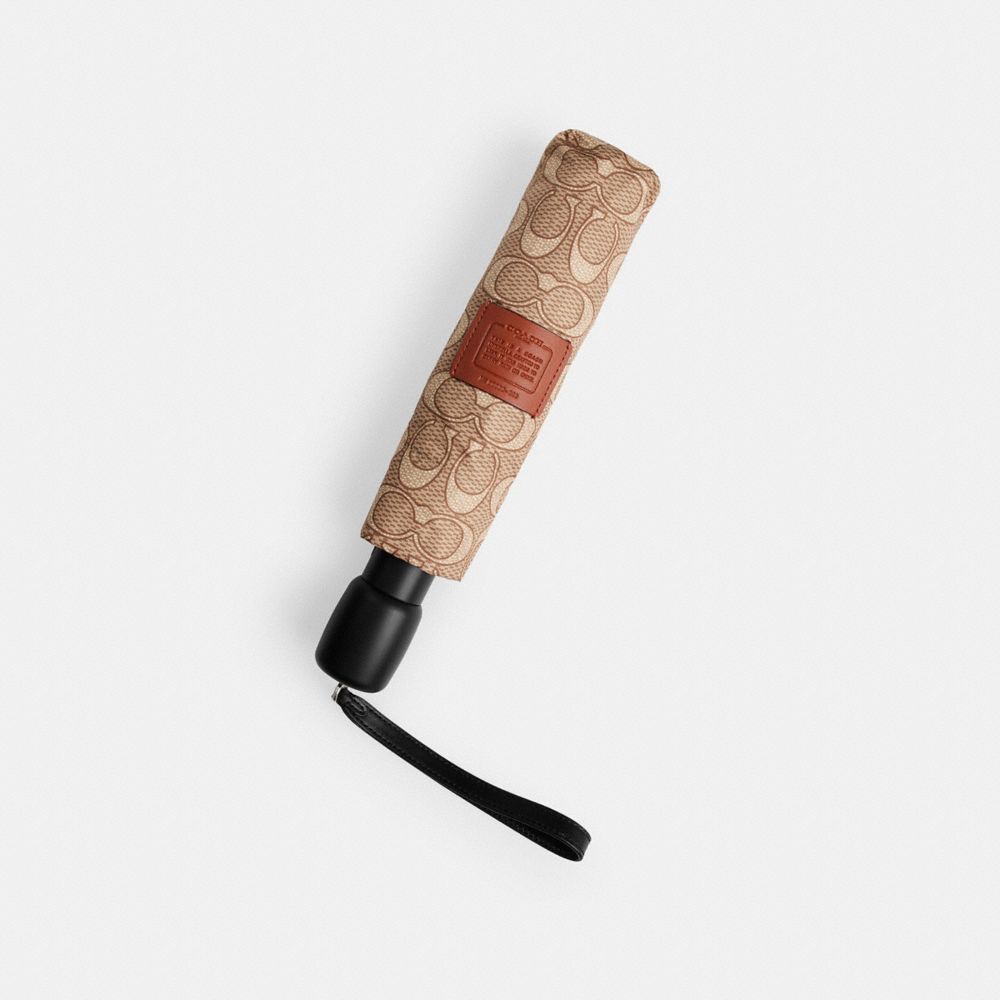 COACH®,Signature Umbrella,Brown,Angle View
