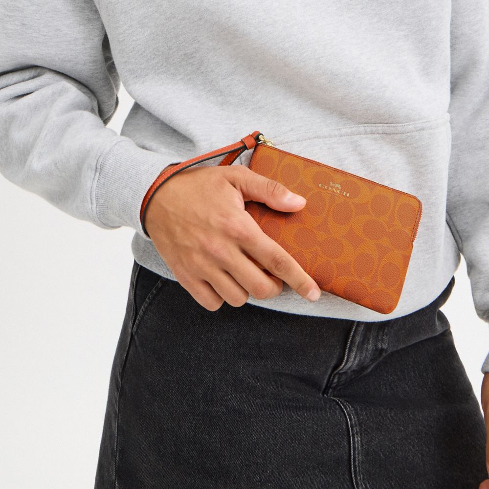 COACH®,Corner Zip Wristlet In Signature Canvas,Wristlet,Pouch,Plastic,Casual,Brown,Detail View