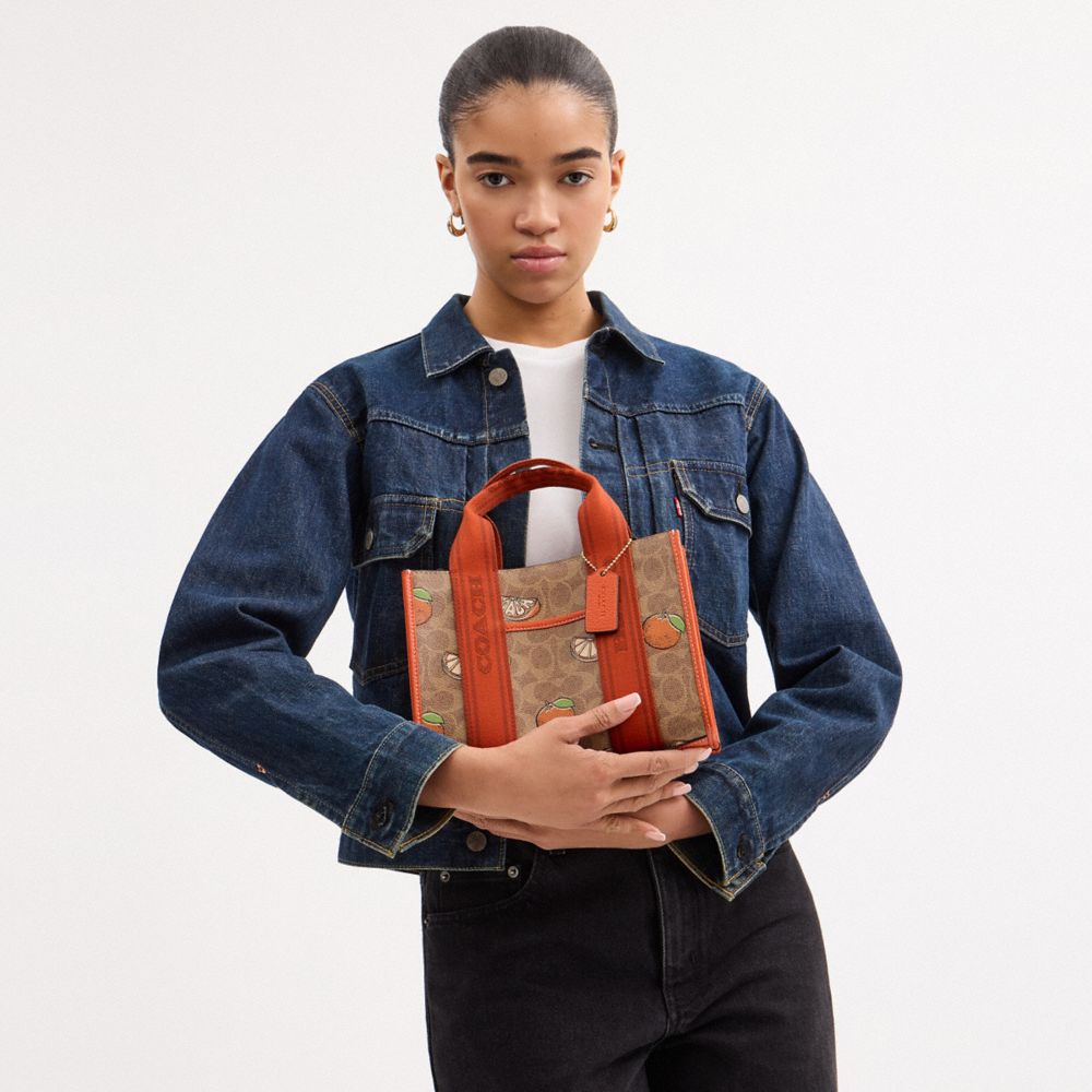 COACH®,Smith Tote Bag 24 In Signature Canvas With Orange Print,,Detail View