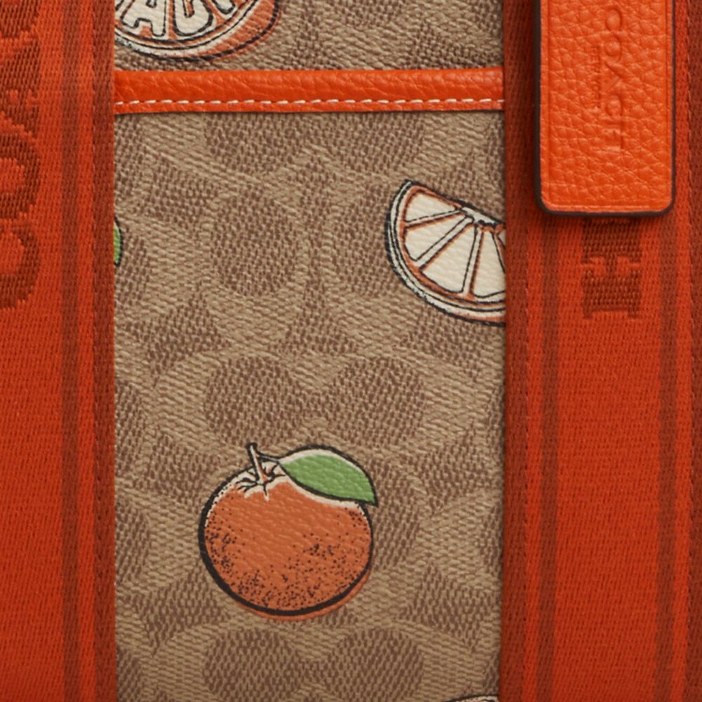 COACH®,Smith Tote Bag 24 In Signature Canvas With Orange Print,,Closer View