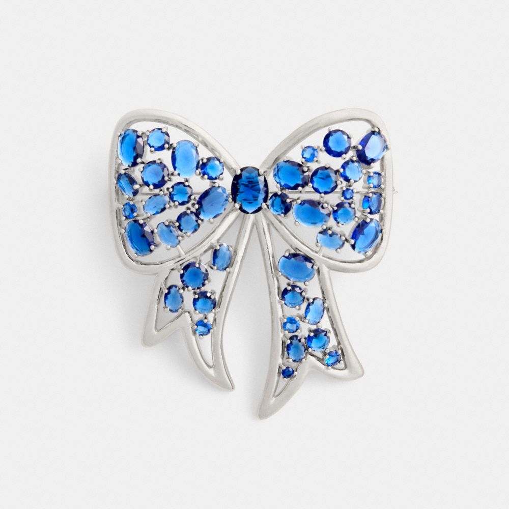 COACH®,Crystal Bow Brooch,Brooch,Cubic Zirconia,Glass,Gem Embellishment,Bow,Cocktail,Blue,Front View image number 0