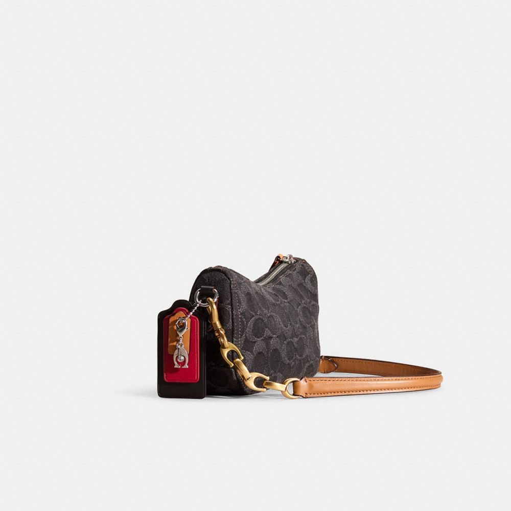 COACH®,Upcrafted Swinger Bag 20 In Signature Denim,,Angle View