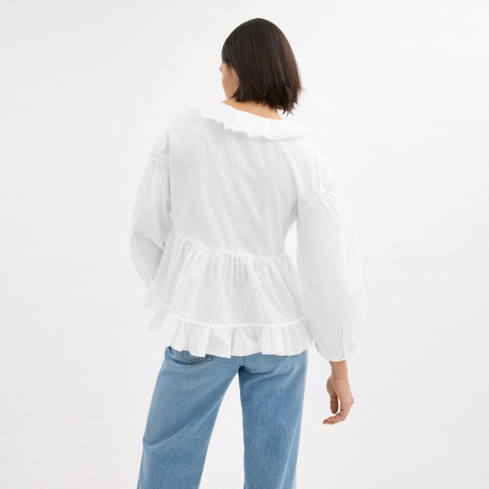 Shop Coach Ruffle Blouse In White