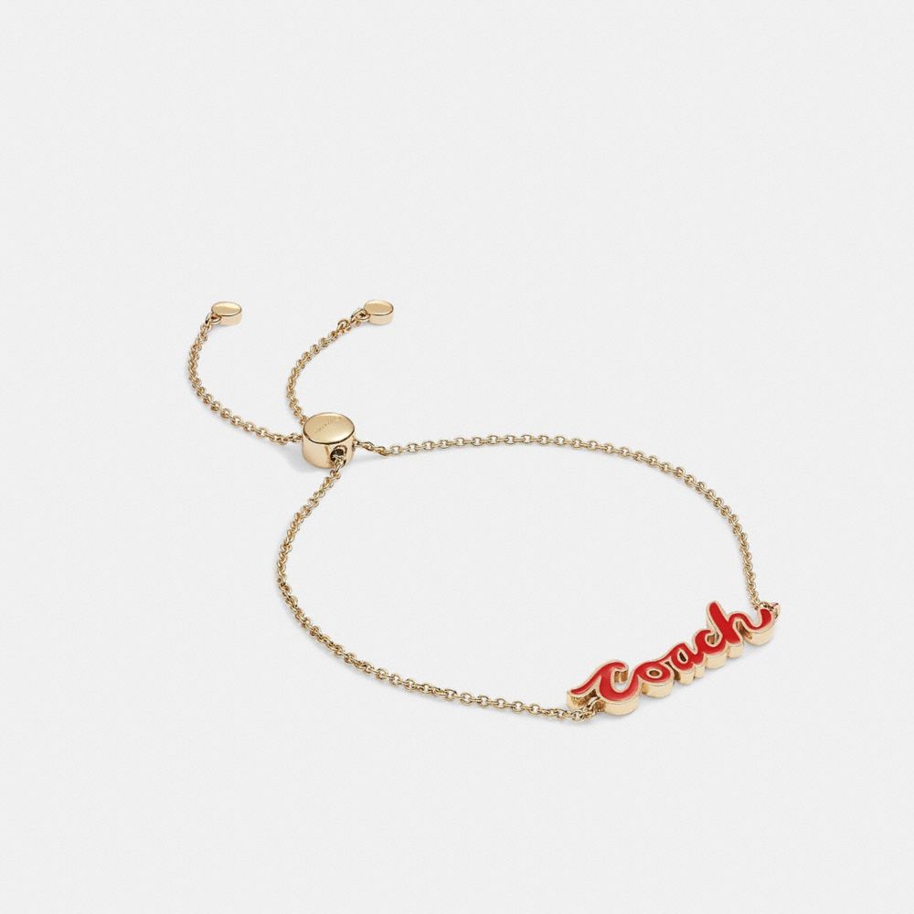 COACH®,BRACELET COULISSANT EN ÉMAIL AVEC LOGO ÉCRITURE,Laiton,ROUGE/DORÉ,Front View