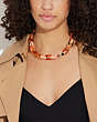 COACH®,CHUNKY SIGNATURE LINK NECKLACE,Brass,Gold/Coral Multi,Detail View
