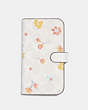 COACH®,IPHONE 13 PRO FOLIO IN SIGNATURE CANVAS WITH MYSTICAL FLORAL PRINT,Chalk Multi,Front View