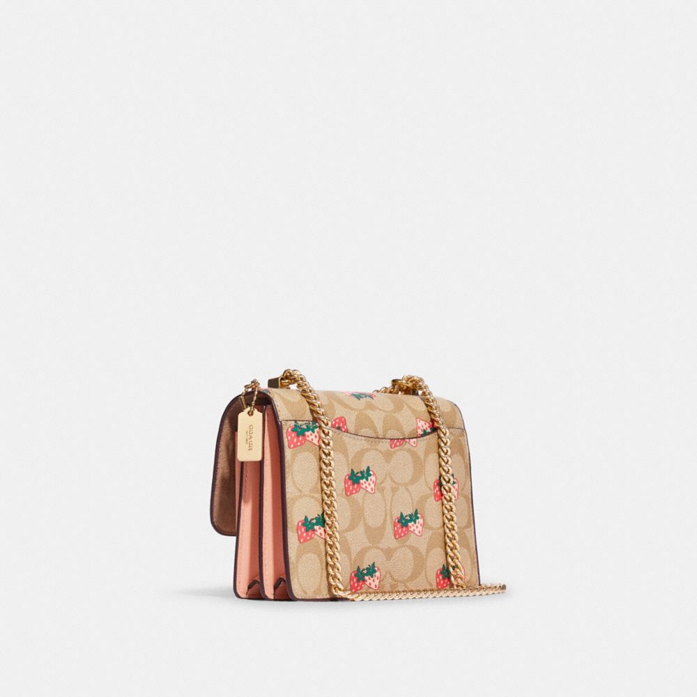 Coach Outlet Nolita 19 In Signature Canvas With Strawberry Print