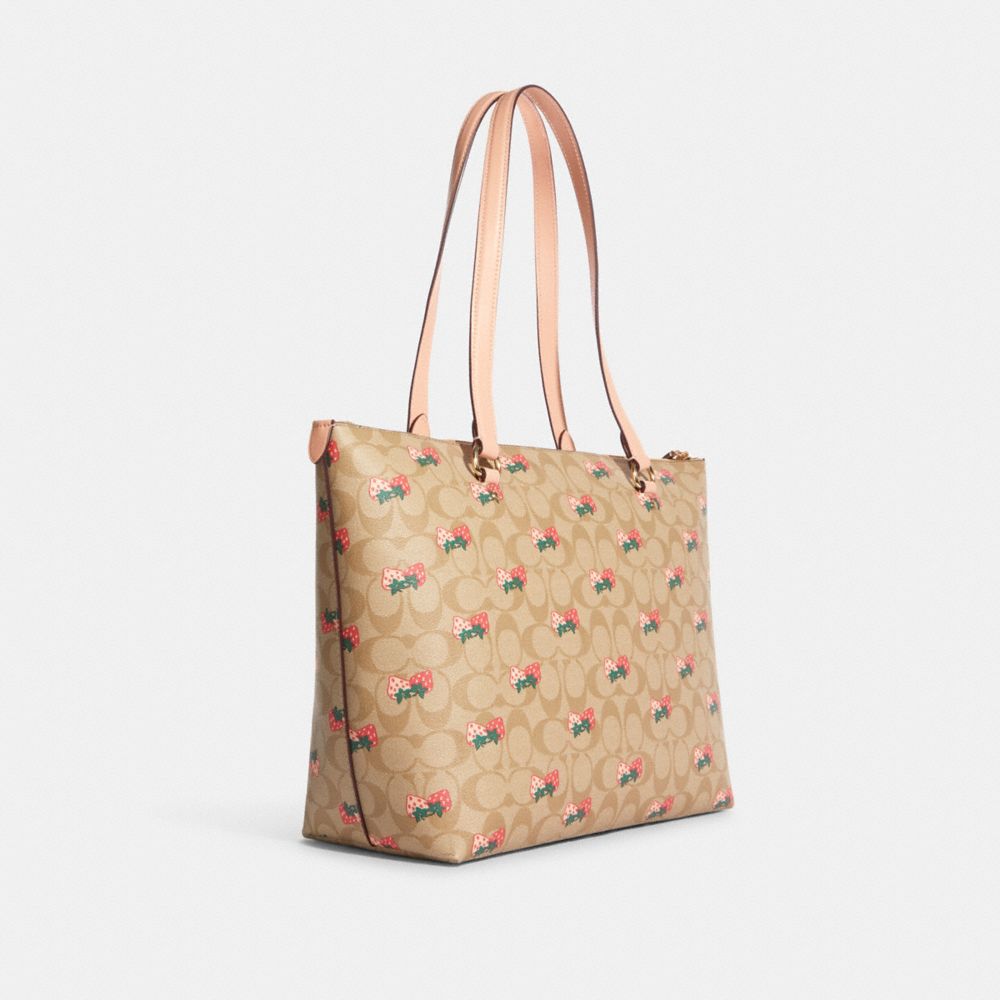 COACH®,GALLERY TOTE IN SIGNATURE CANVAS WITH STRAWBERRY PRINT,X-Large,Gold/Light Khaki Multi,Angle View