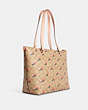 COACH®,GALLERY TOTE IN SIGNATURE CANVAS WITH STRAWBERRY PRINT,X-Large,Gold/Light Khaki Multi,Angle View