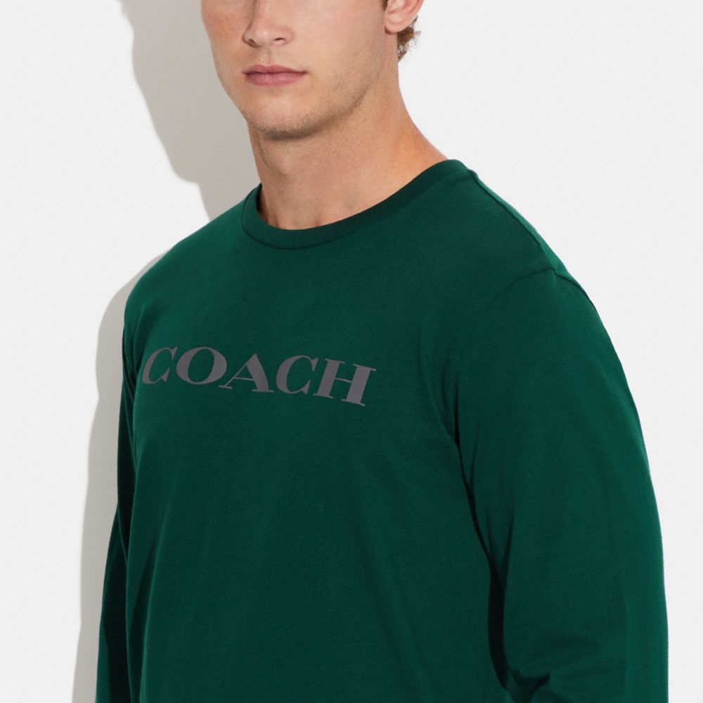 COACH®,Essential Long Sleeve T Shirt In Organic Cotton,Organic Cotton,T Shirt,Logo,Word Embellishment,Casual,Emerald,Detail View