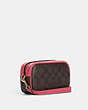 COACH®,JAMIE WRISTLET IN SIGNATURE CANVAS WITH VARSITY MOTIF,Signature Coated Canvas,Small,Im/Brown/Watermelon,Angle View