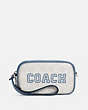 COACH®,JAMIE WRISTLET IN SIGNATURE CANVAS WITH VARSITY MOTIF,Signature Coated Canvas,Small,Silver/Chalk/Indigo,Front View