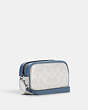 COACH®,JAMIE WRISTLET IN SIGNATURE CANVAS WITH VARSITY MOTIF,Signature Coated Canvas,Small,Silver/Chalk/Indigo,Angle View
