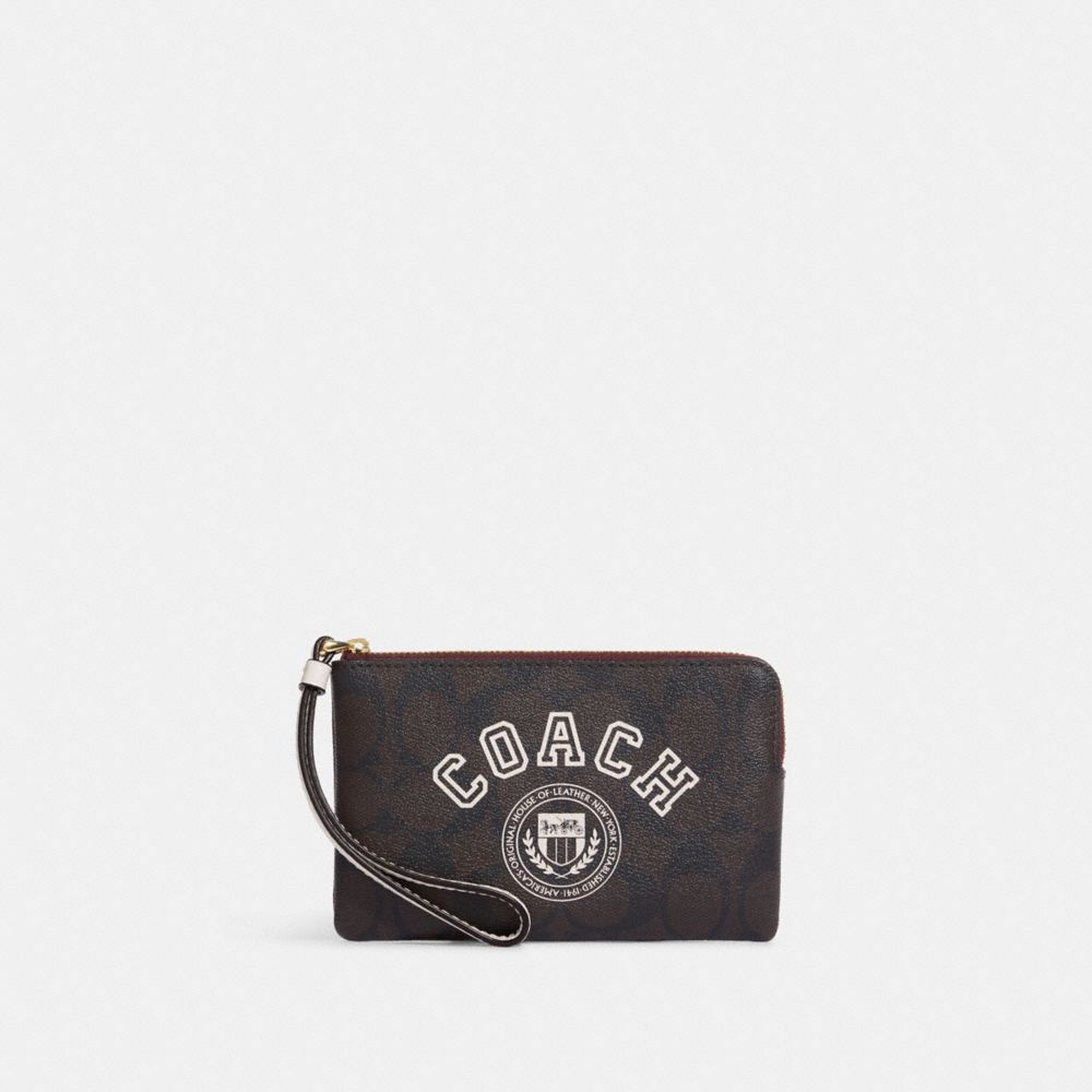 COACH®,Corner Zip Wristlet In Signature Canvas With Varsity Motif,,Front View