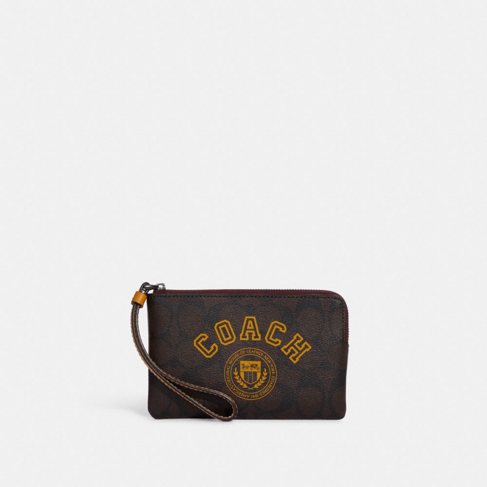 COACH®,Corner Zip Wristlet In Signature Canvas With Varsity Motif,,Front View