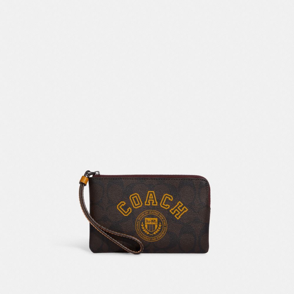 COACH®,CORNER ZIP WRISTLET IN SIGNATURE CANVAS WITH VARSITY MOTIF,Signature Canvas,Mini,Black Antique Nickel/Brown/Buttercup,Front View