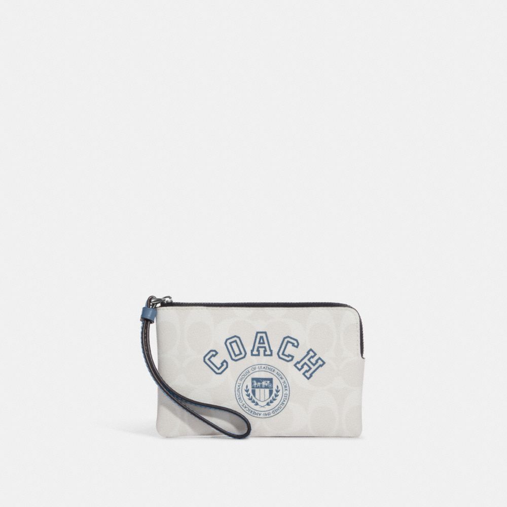 COACH®,CORNER ZIP WRISTLET IN SIGNATURE CANVAS WITH VARSITY MOTIF,Signature Canvas,Mini,Silver/Chalk/Indigo Multi,Front View