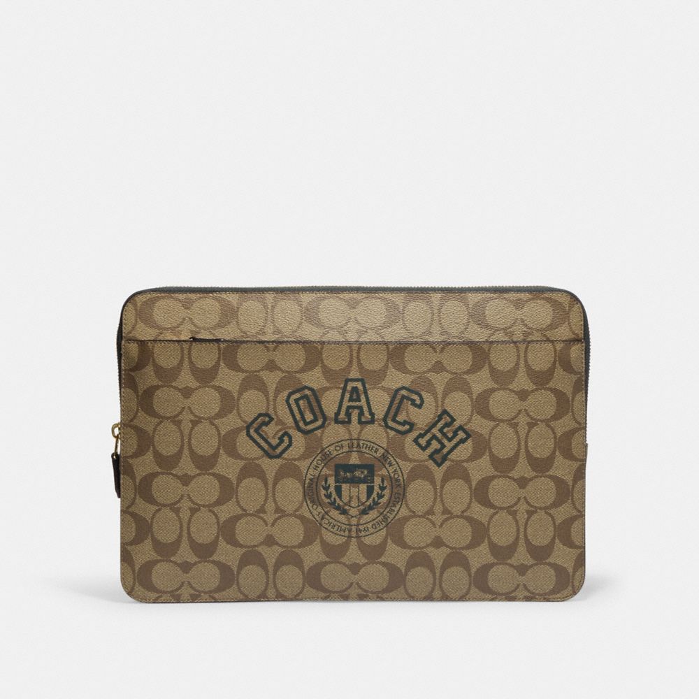 Shop Coach Laptop Sleeve In Signature Canvas With Coach Varsity