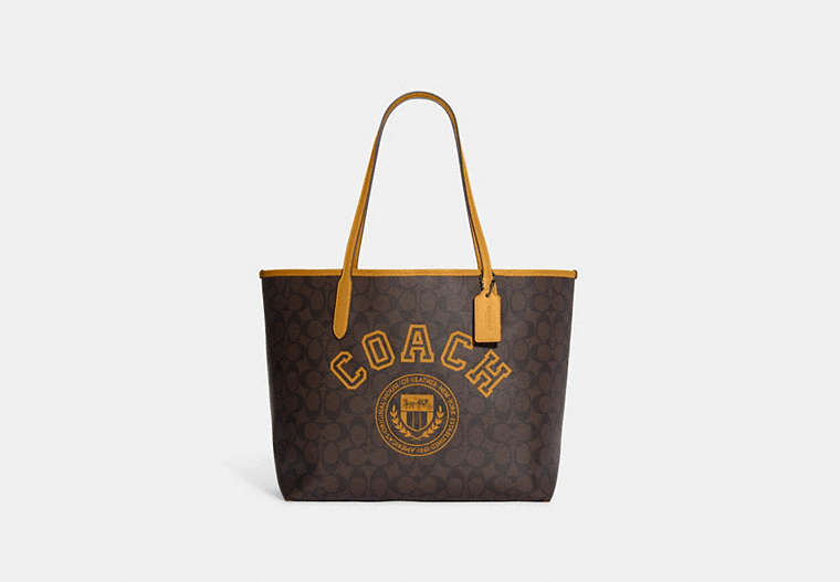 COACH®,CITY TOTE BAG IN SIGNATURE CANVAS WITH VARSITY MOTIF,Signature Coated Canvas,Large,Black Antique Nickel/Brown/Buttercup,Front View