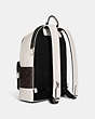 COACH®,WEST BACKPACK IN SIGNATURE CANVAS WITH VARSITY MOTIF,Large,Black Antique Nickel/Mahogany/Chalk,Angle View
