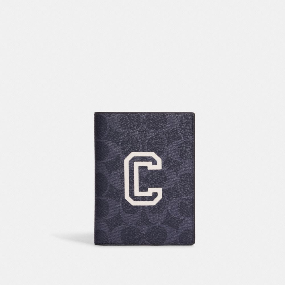 COACH®,PASSPORT CASE IN SIGNATURE CANVAS WITH VARSITY MOTIF,Mini,Black Antique Nickel/Denim/Chalk,Front View